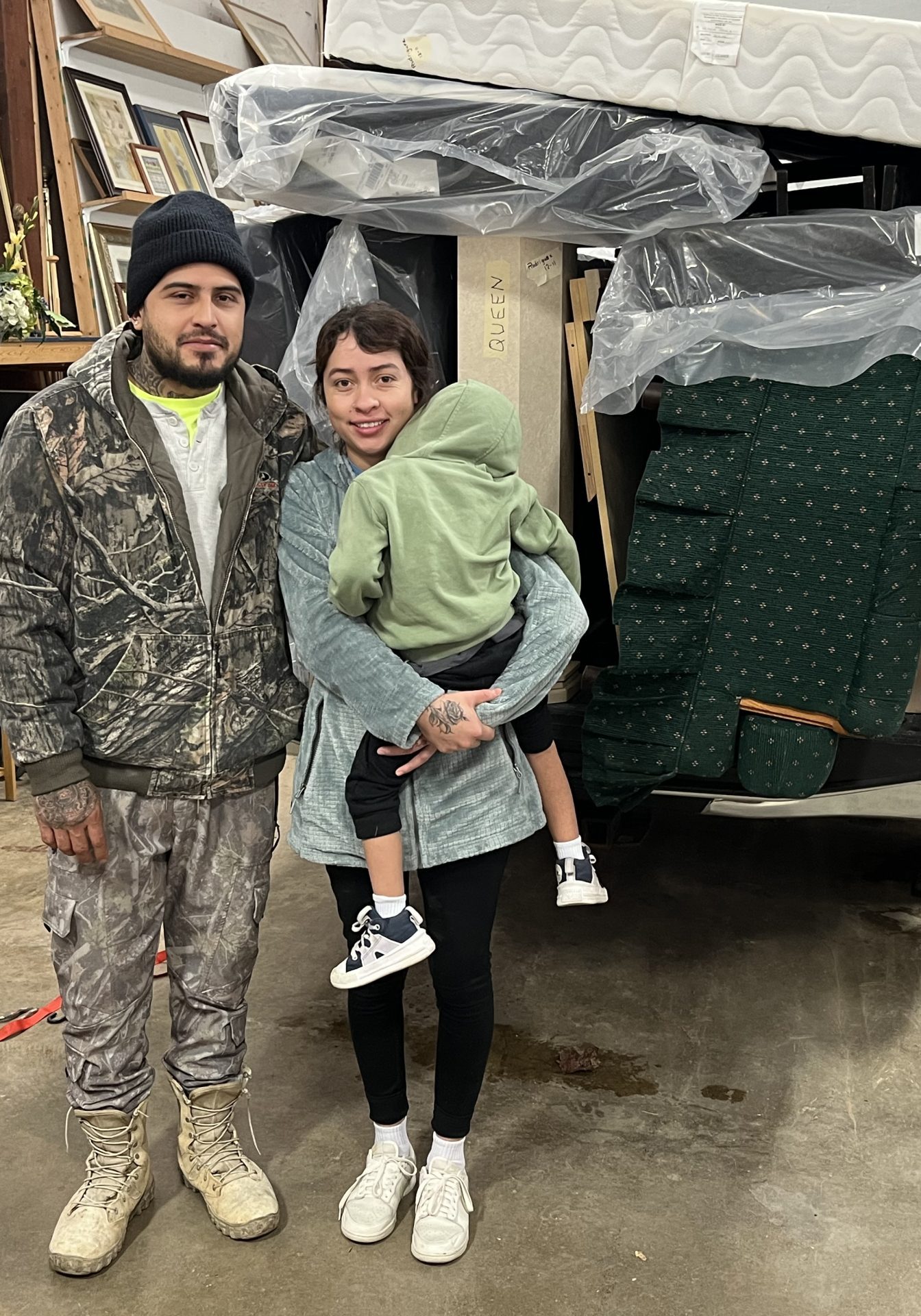 Family Standing by Furniture